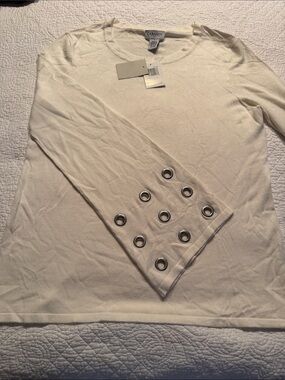 Super cool cream colored sweater with hip extra long grommet detailed sleeves.